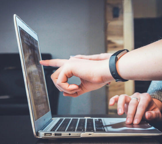 person on computer looking up domain